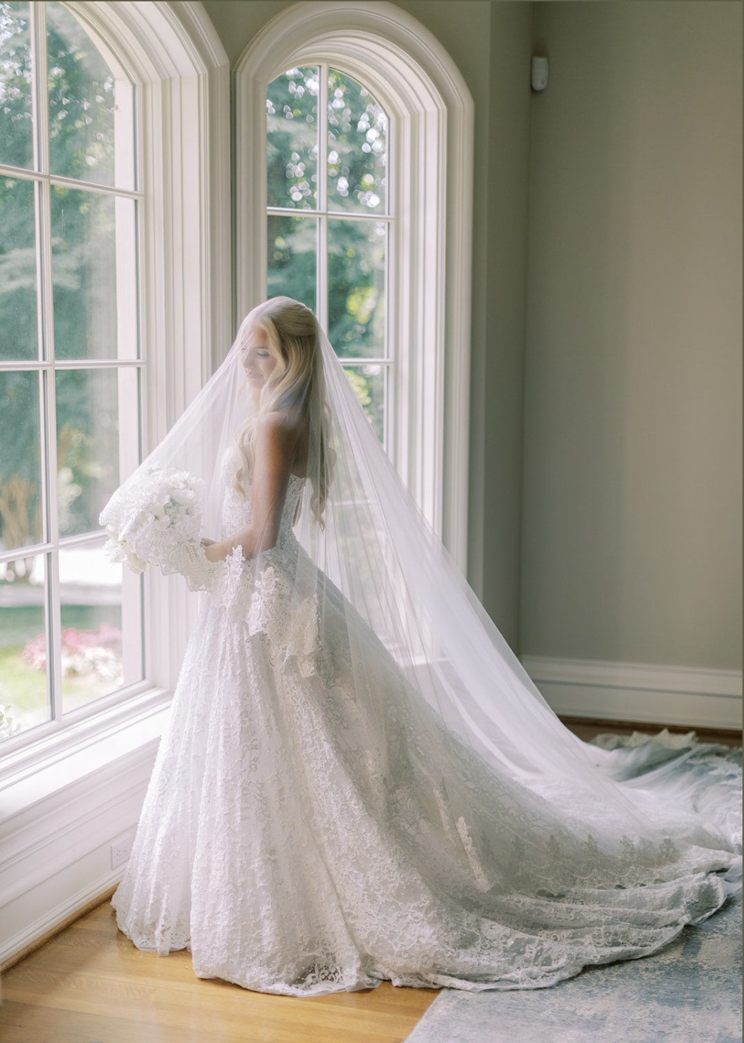 A bride in her veil by the window